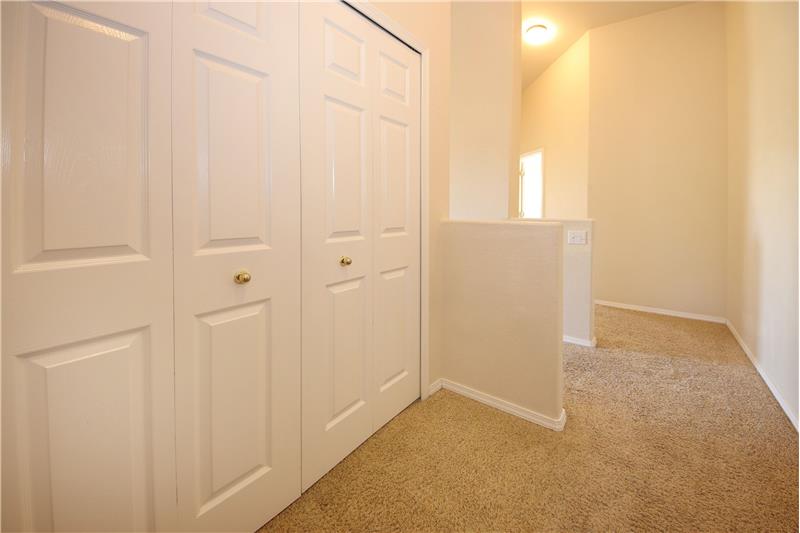 Laundry closet located on the upper level landing