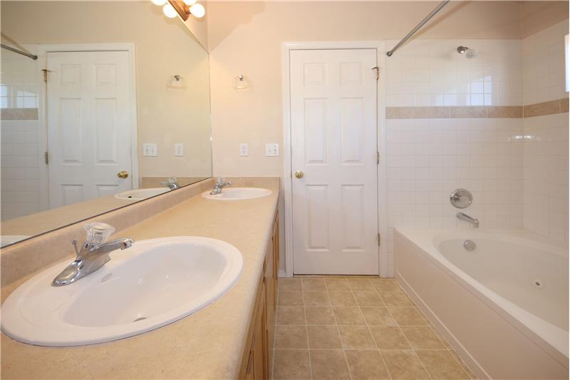 Master Bathroom with vanity and tub/shower