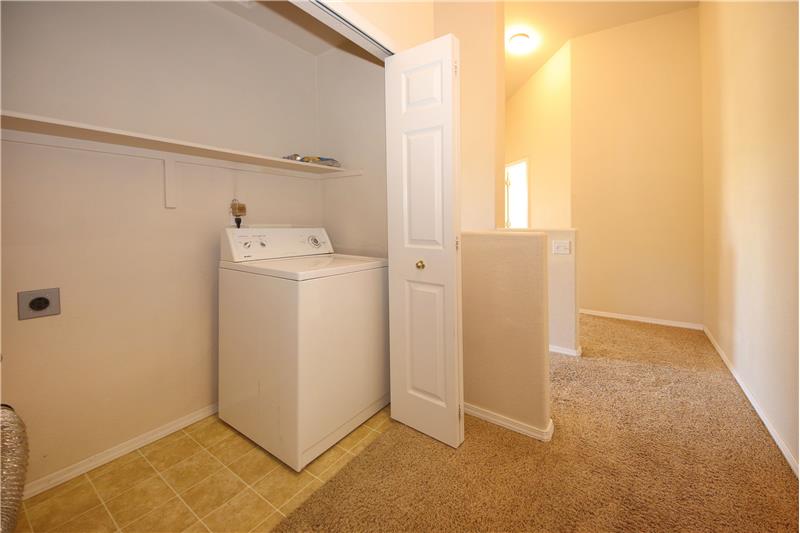Laundry Closet with shelf and newer washer that stays