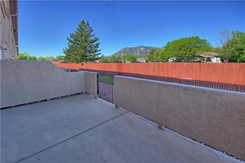 Walled patio with mountain views