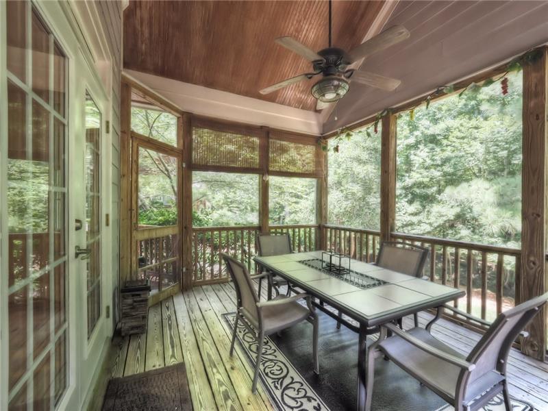 Screened Porch overlooking the backyard and golf course