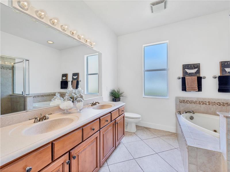 Master Bathroom with separate tub and shower, dual Corian integrated sinks