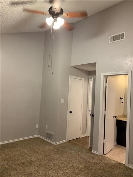 Second bedroom Upstairs featuring a ceiling fan and light carpet