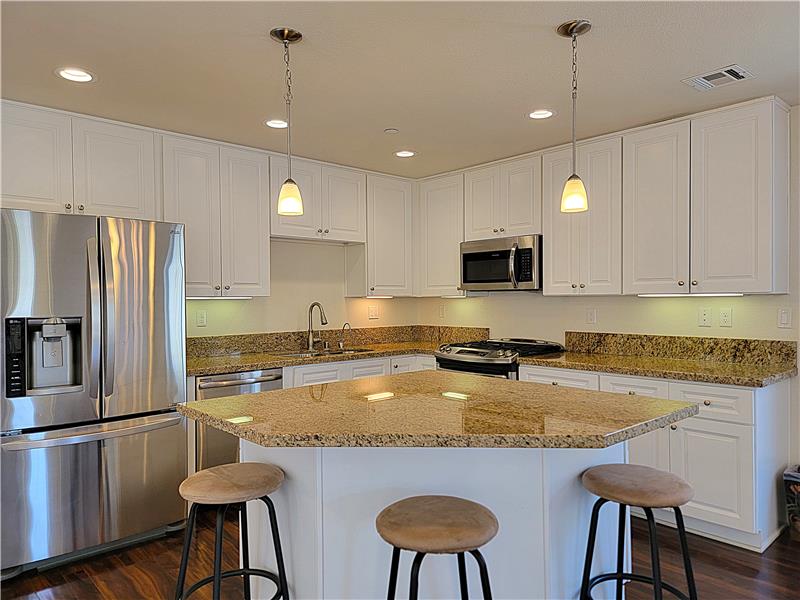 This Great Room design truly fosters great communication!! Smart to call it an 'island'; folks are gonna land here, for sure.