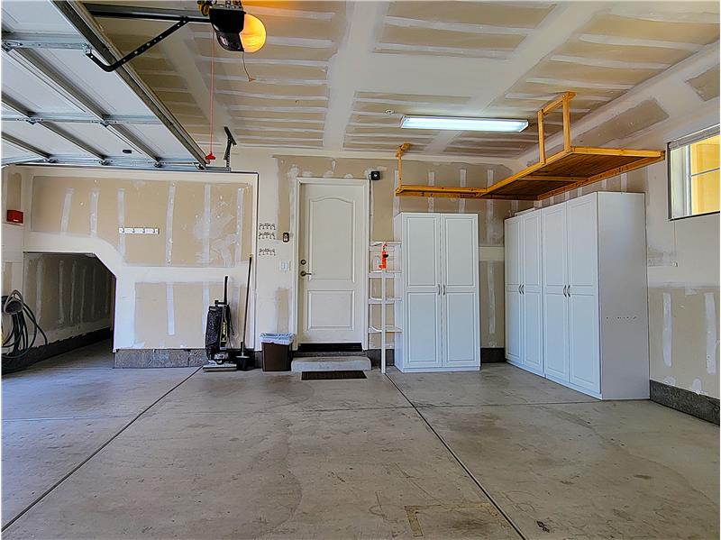 Five storage cabinets, as well as overhead storage; this home is designed to grow with your needs!