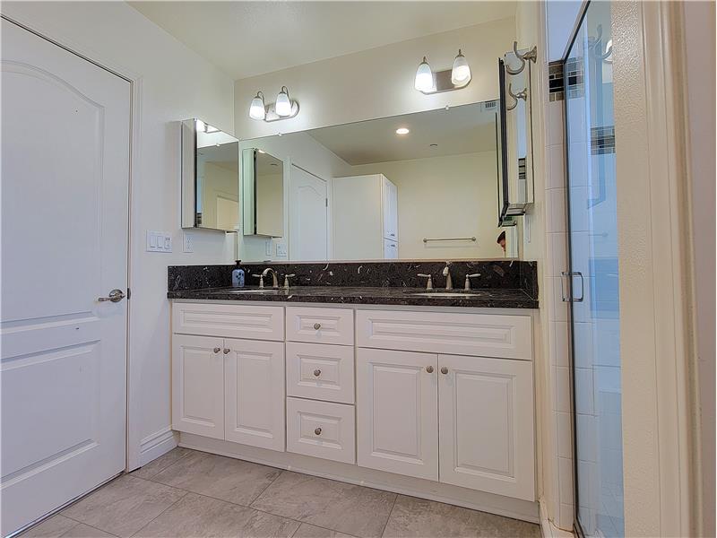 Granite counter, dual sinks, steam sensing exhaust fan, motion sensing lights, brushed Nickle fixtures, soft-close drawers!