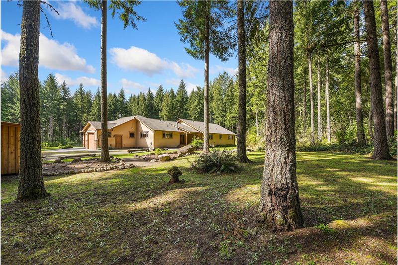 Looking North-West - East and South face of home visible through your private park-like property.