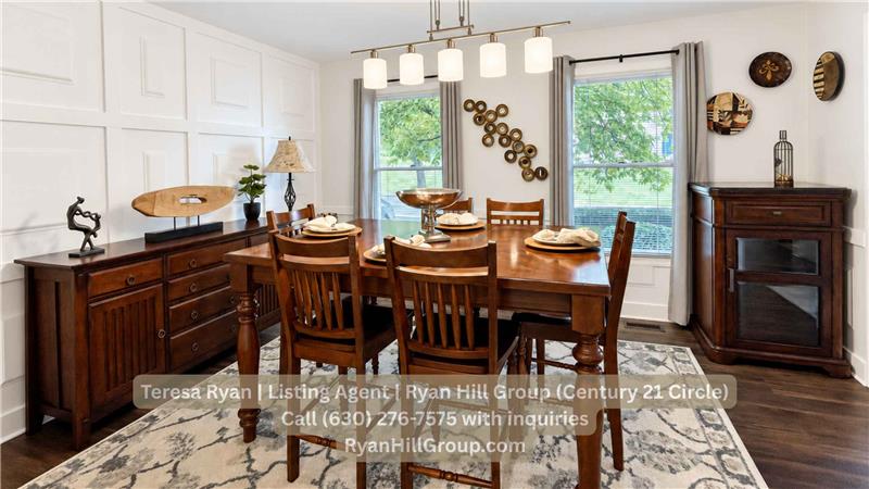 The dining room with full-wall and half-wall wainscoting frame the space