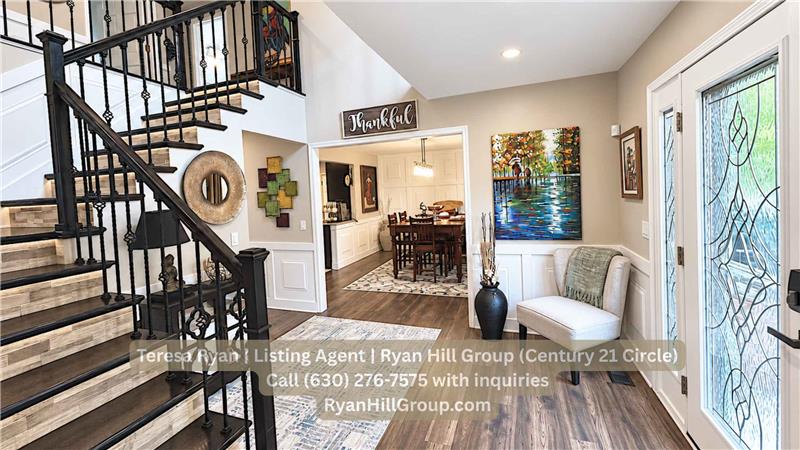 Decorative wood-and-glass front door into an 11-by-11-foot foyer.