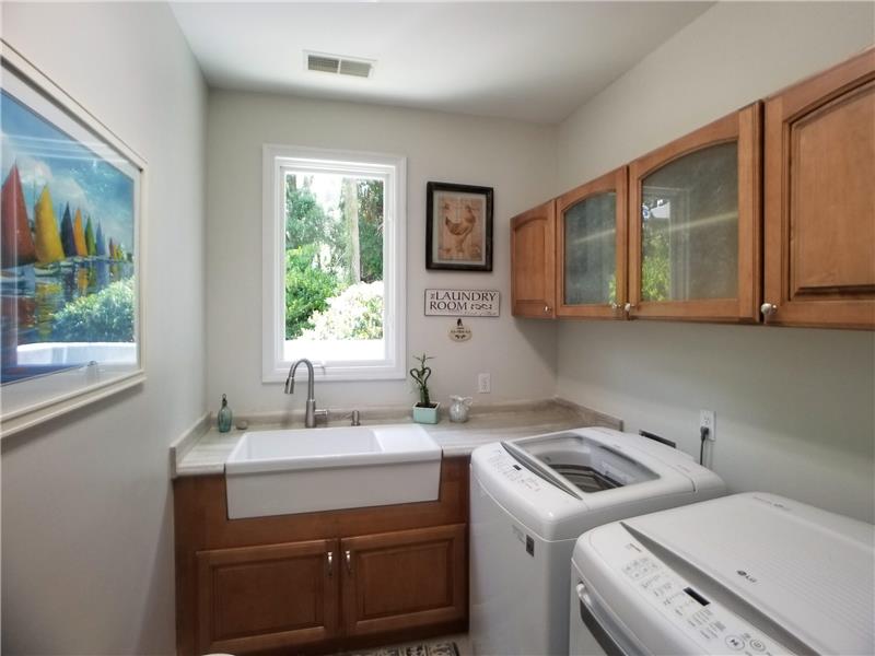 Laundry room with a great view from the farm sink