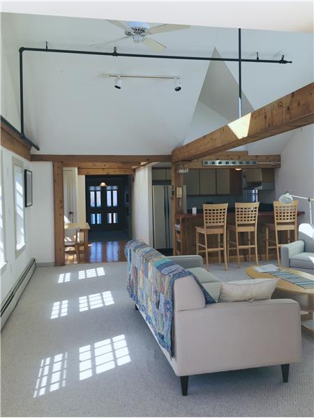 Cathedral ceiling dining & living room with all new skylights and amazing window views.