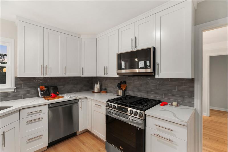 Soft close cabinets, Quartz Countertops, Gas Range