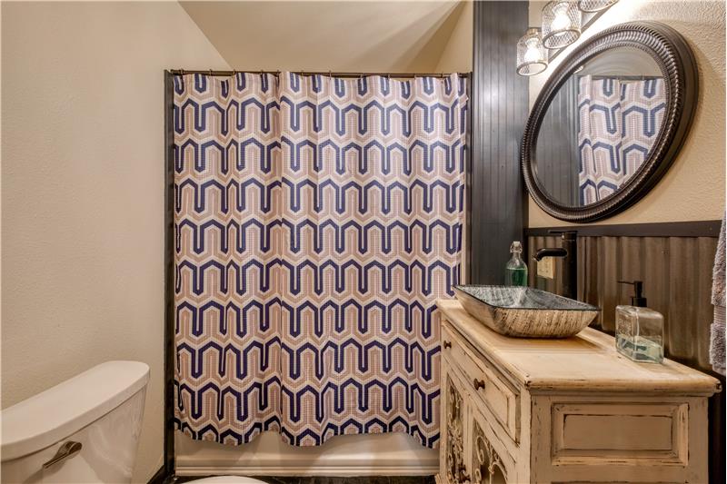 Guest bathroom with slate tile flooring