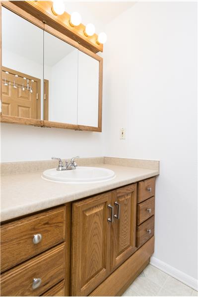 Well-lit bathroom vanity with ample storage