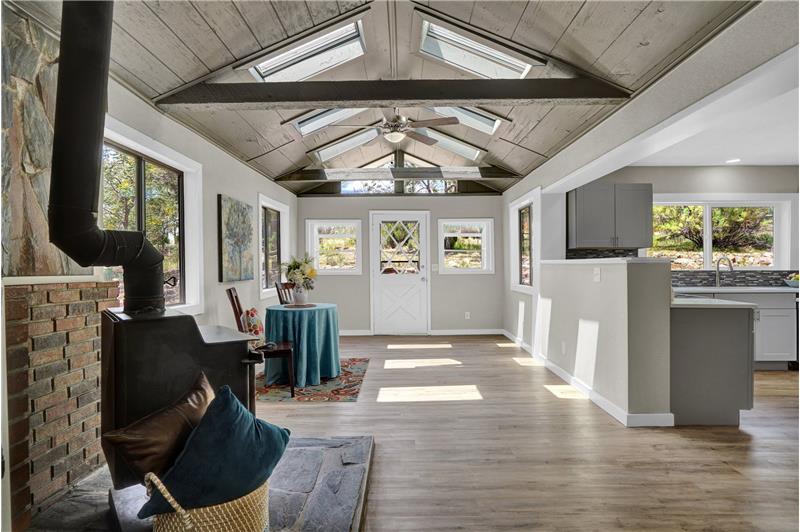 Vaulted Dining Room with beamed ceiling into Gourmet Kitchen