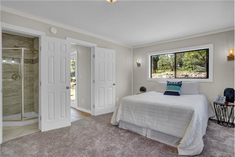 Main level Primary Bedroom and Shower Bathroom