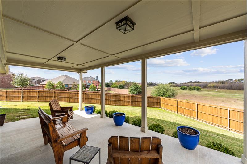 This grand extended porch and this amazing park and greenbelt view!