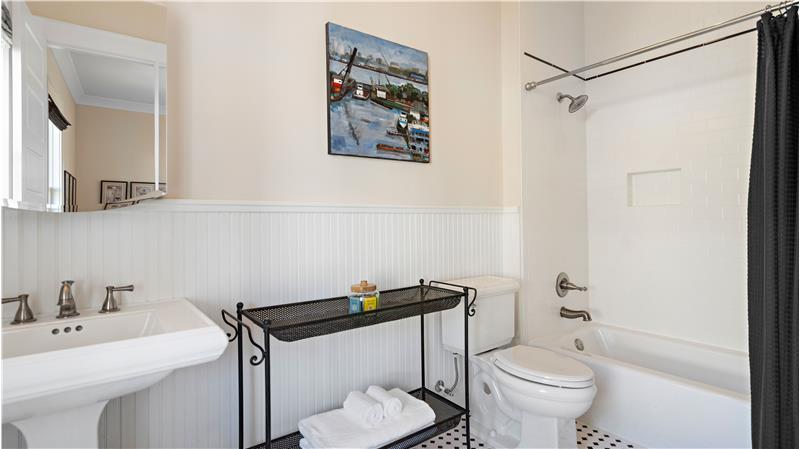 Ensuite bath (1/2 bath is located near living room off center hall)