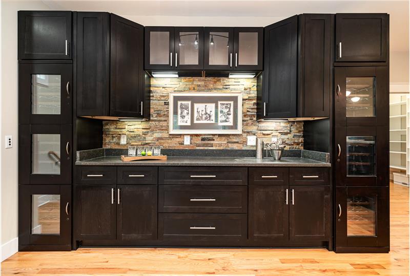 Bar with wine racks, lots of cabinetry