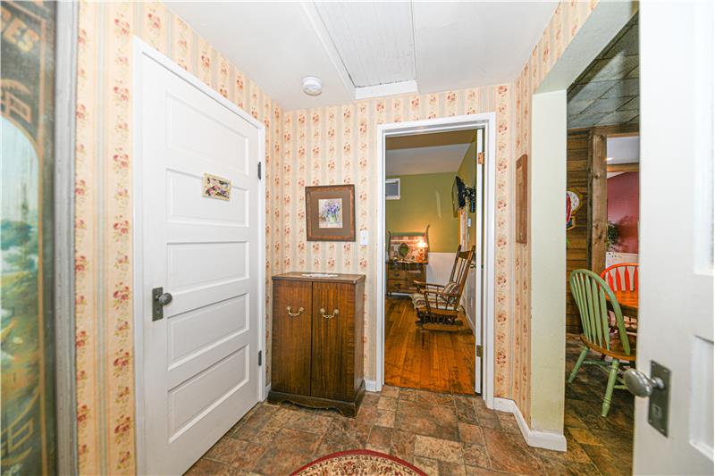 Another angle of hallway looking into the primary bedroom. Attic access is in this hallway.