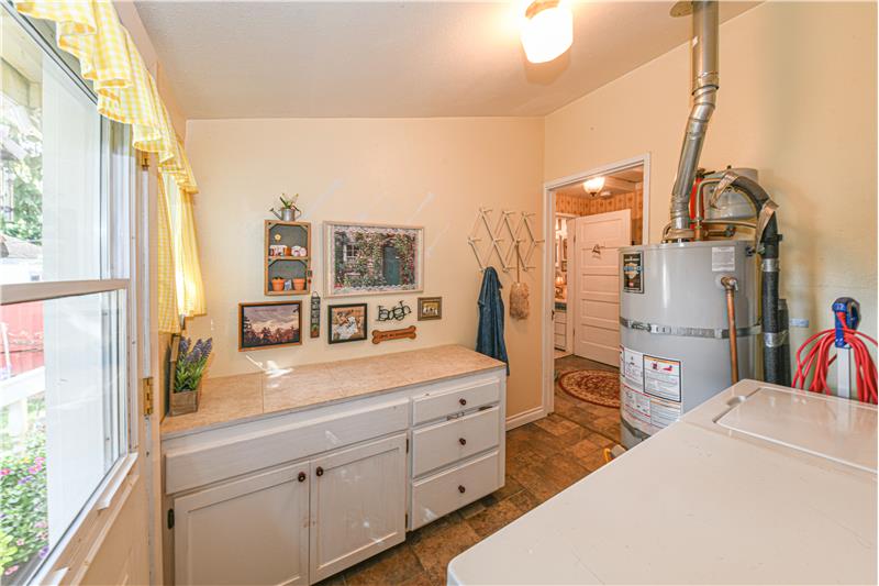 Another angle of the utility room showing the new hot water tank.