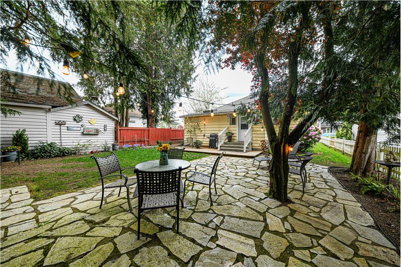 Backyard oasis. Great for relaxing by yourself or having people over. Grey building belongs to the neighbor.