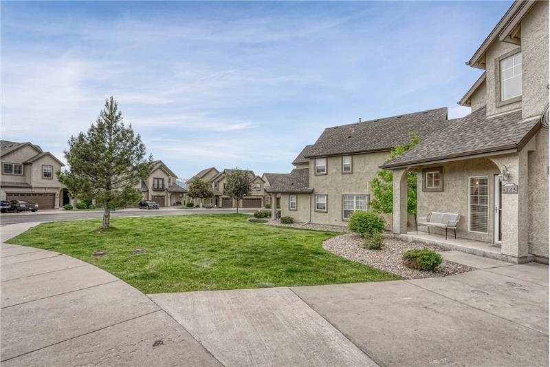 Covered front porch and nice grassy area