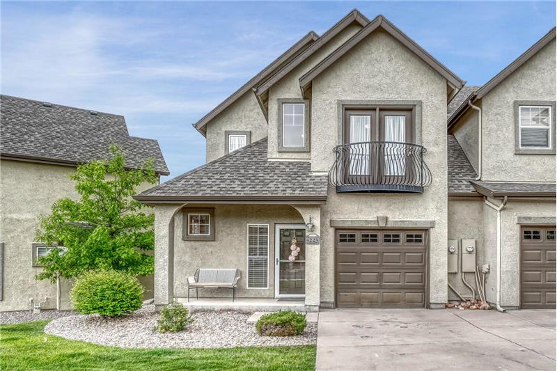 Attractive exterior with stucco and stone