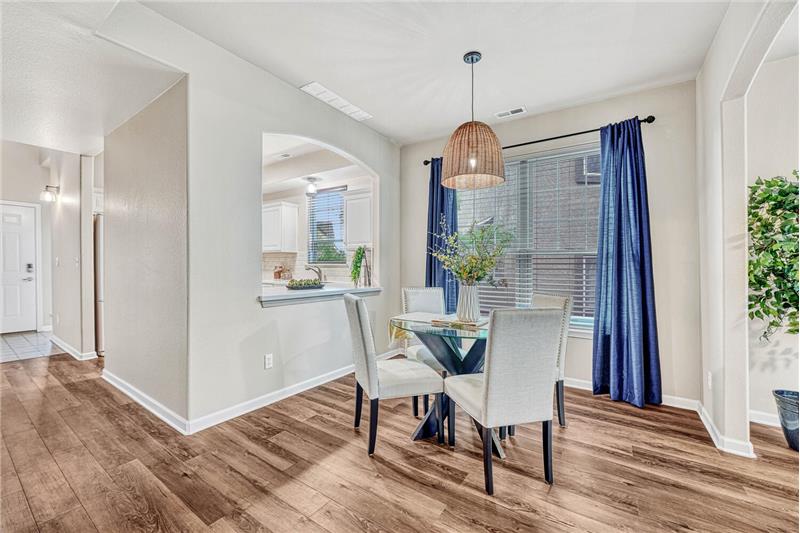 Dining area with window and new light fixture