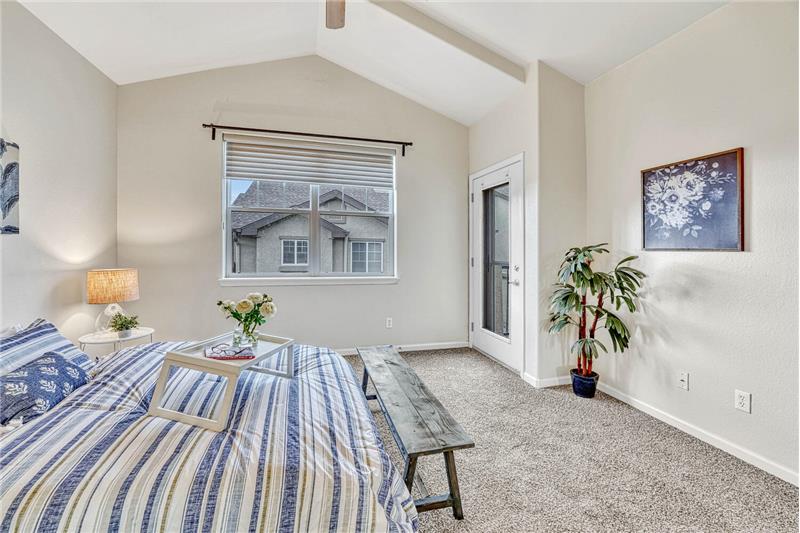Primary bedroom provides a walk-out to a private balcony