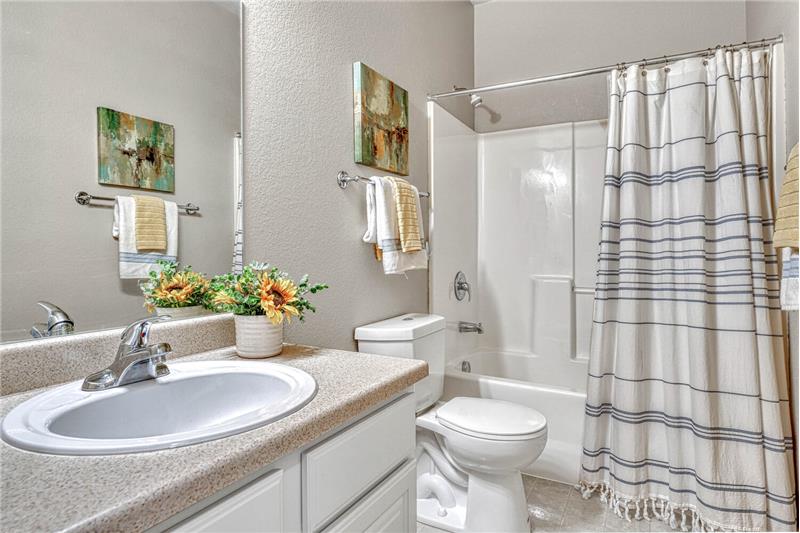 Upper level full bath with updated lighting