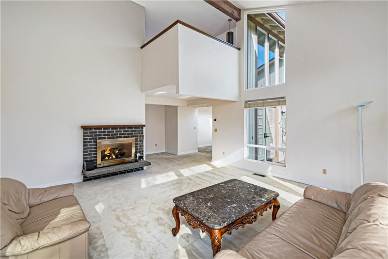 Living Room features vaulted ceiling and lots of natural light