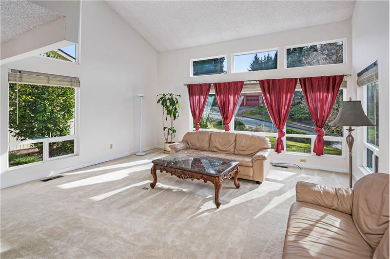 Living Room features vaulted ceiling and lots of natural light