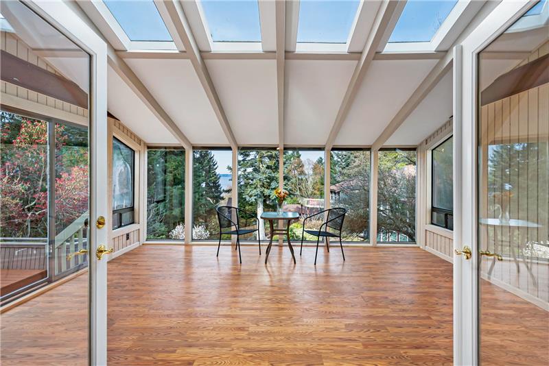 The atrium immerses you in sunlight and and provides the perfect setting for your morning coffee with a view of the Puget Sound