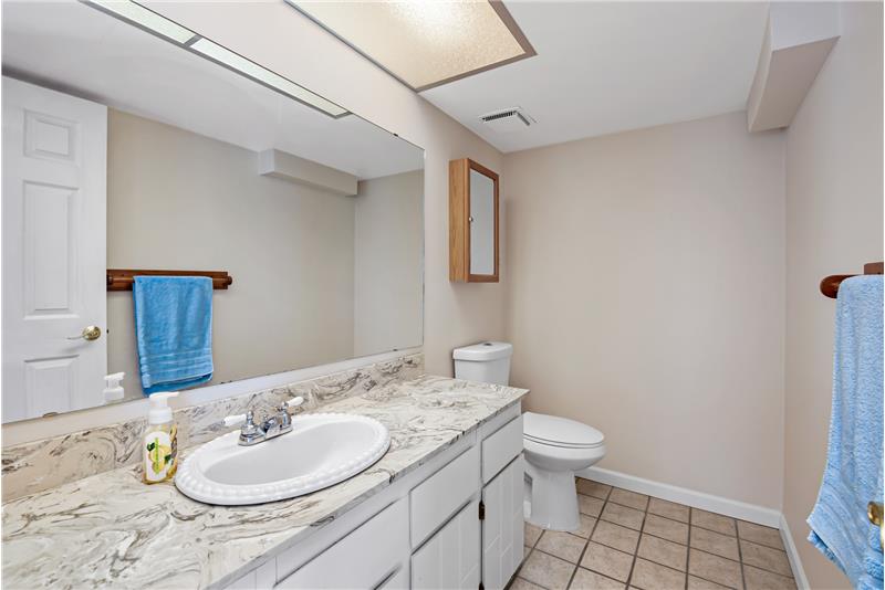 This main floor bath is adjacent the family room and entryway.