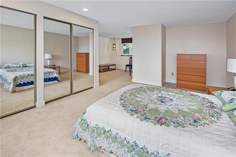 Plenty of room for a King size bed and wardrobe/armoir in this large primary bedroom.