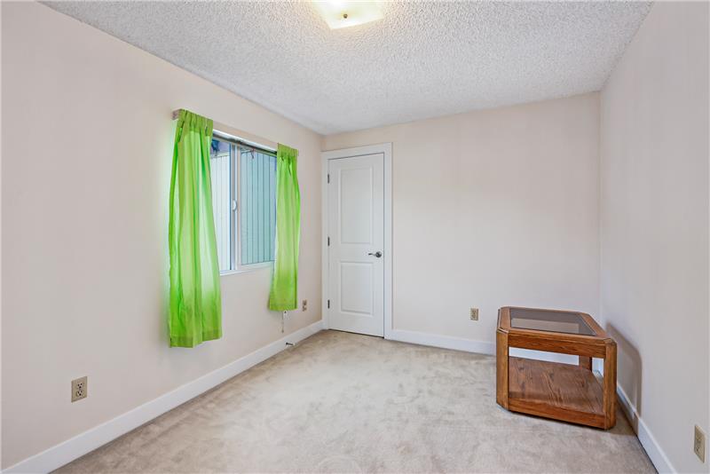 Bedroom 4 features a walk-in closet and access to attic storage.