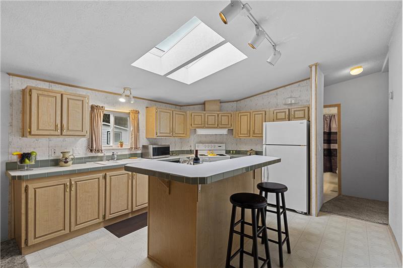 Kitchen island has a breakfast bar