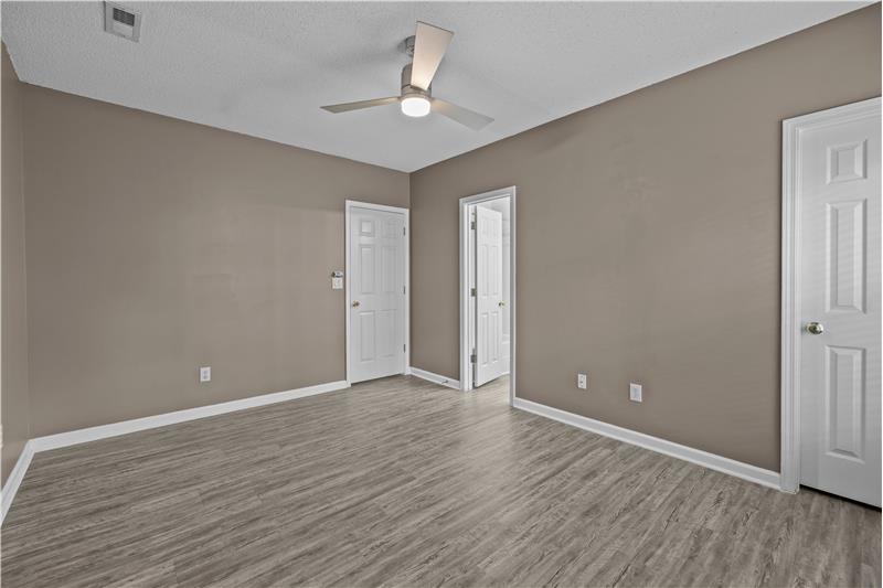 Primary bedroom features walk-in closet, en-suite bathroom