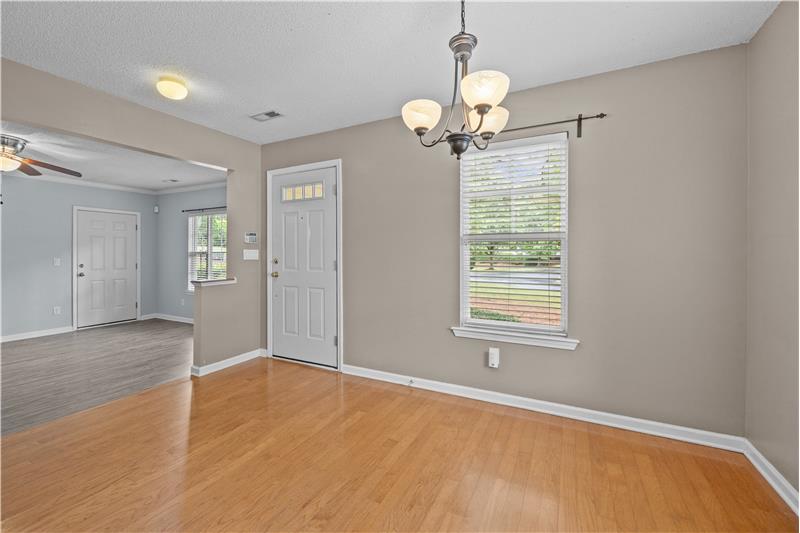 Dining room has open sight lines to the living room