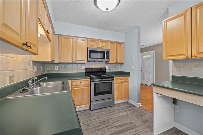 Kitchen offers ample cabinet and counter space