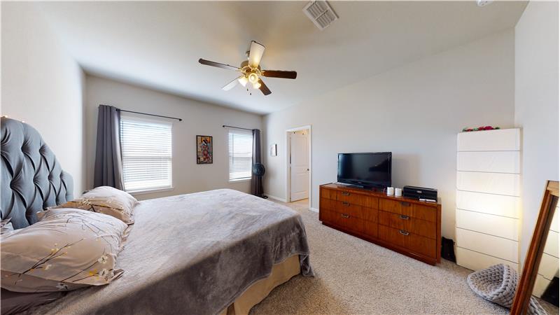 The spacious master bedroom has great windows to give you plenty of natural lighting.