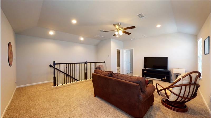 Upstairs features a game room, bedroom, and bath.