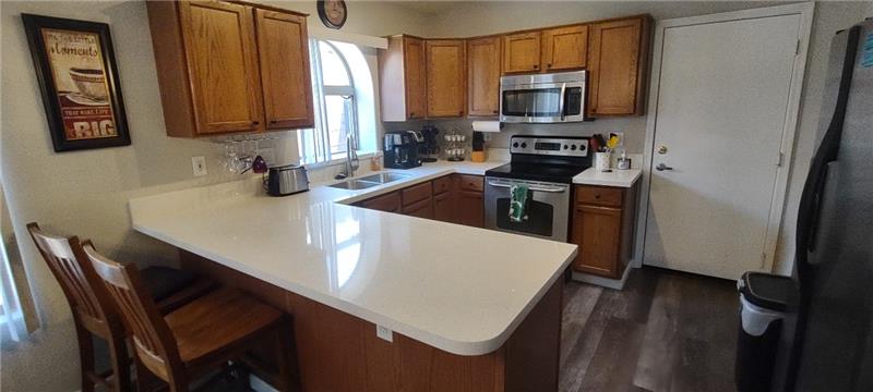 Inviting kitchen with Quartz counters