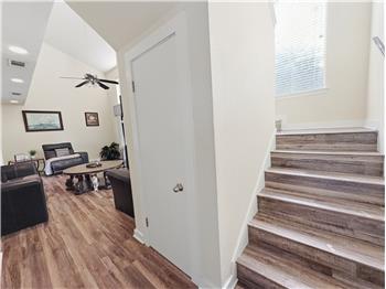 Entry with storage under the stairs.