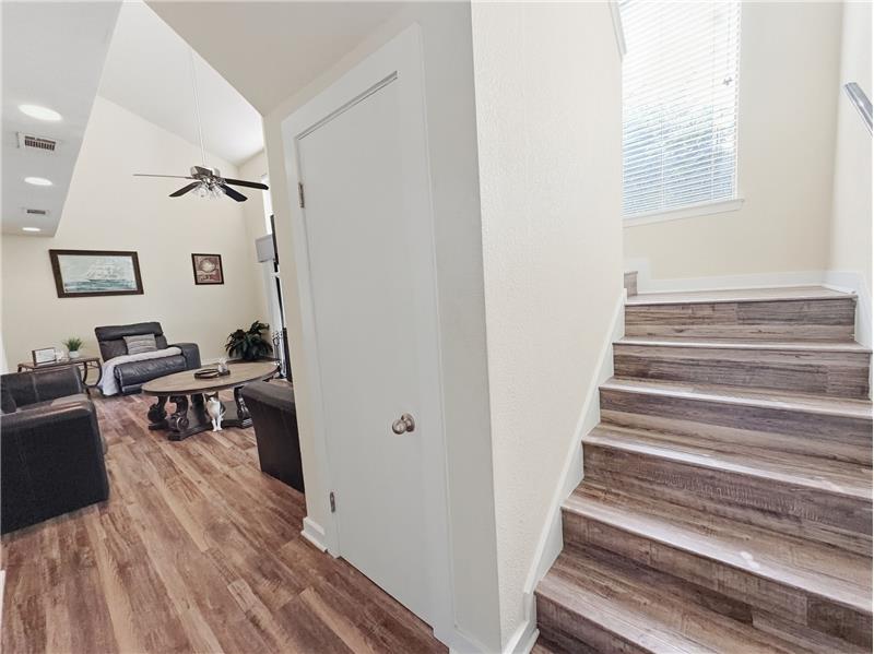 Entry with storage under the stairs.