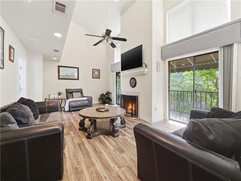 High ceilings and lots of light with windows opening onto the tree lined street.