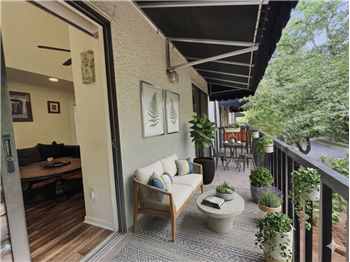 Virtually staged patio that runs the length of the unit.