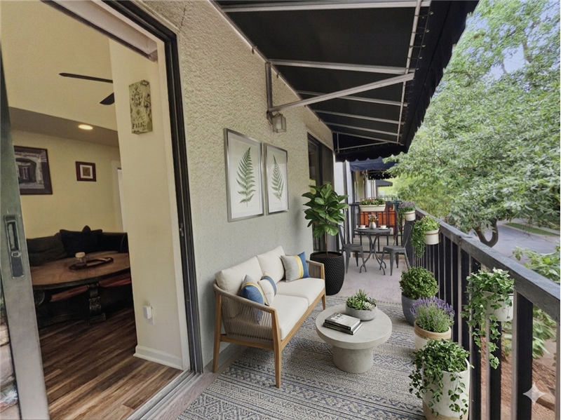 Virtually staged patio that runs the length of the unit.