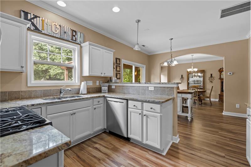Kitchen: granite counters, stainless steel appliances.